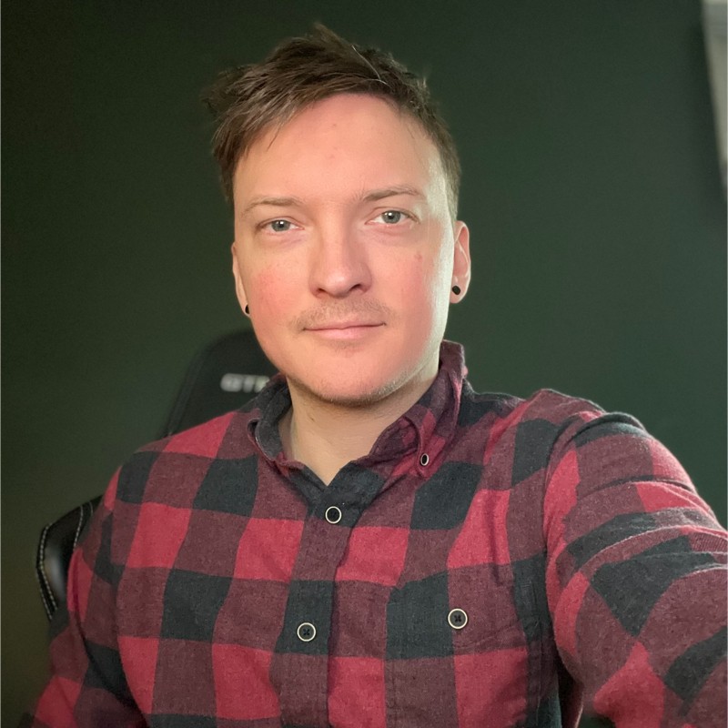 headshot of a white man in a flannel shirt